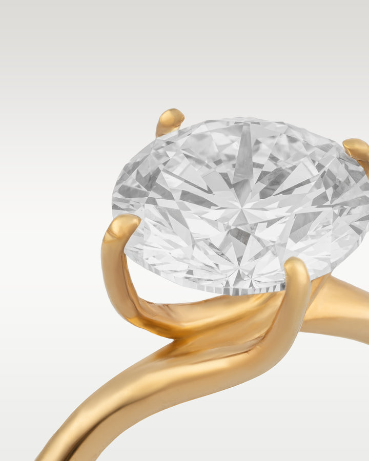 Four Prong Twist Solitaire Diamond Engagement Ring